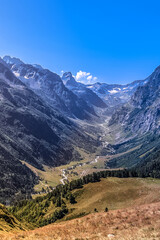 Naklejka premium Picturesque mountain landscape with forest, sky, clouds, river. stream