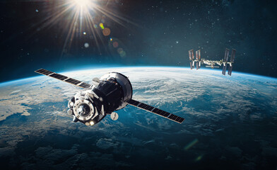 Spaceship and ISS station on orbit of the Earth planet. Outer space. Elements of this image...