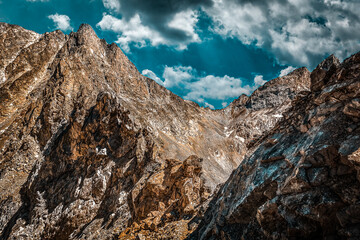 Picturesque mountain scenery with cumulus clouds. Wildlife. Hiking. Daytime. mystical place