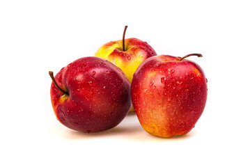 Three ripe mouthwatering apple fruits in water drops on a perfectly white background