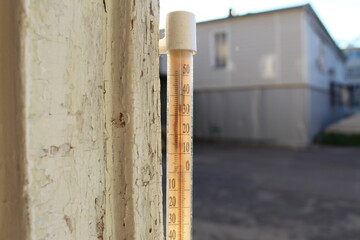 temperature thermometer on the street in the heat of summer
