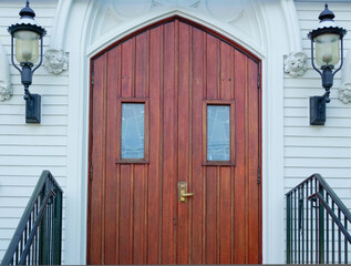 Wooden door and lamps of saint Mary’s Church Holliston Massachusetts USA