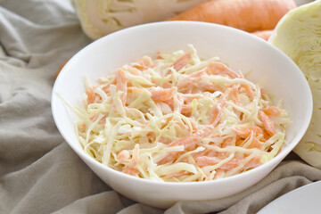 Coleslaw salad with cabbage and carrot.  Healthy and dietary food concept. 