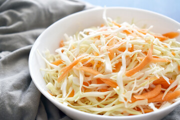 Coleslaw salad with cabbage and carrot.  Healthy and dietary food concept. 