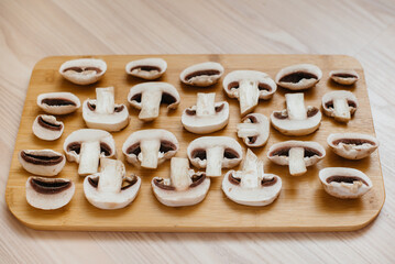 Thinly sliced fresh raw mushrooms for cooking vegetarian dishes . Healthy diet