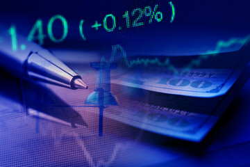 Close up of pin on graph data. Finance concept.