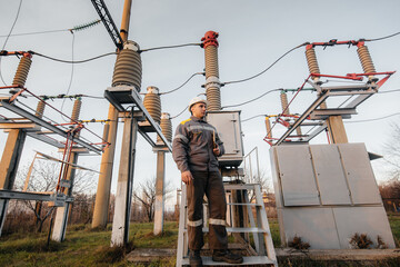 The energy engineer inspects the equipment of the substation. Power engineering. Industry