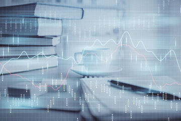 Double exposure of financial chart drawing and desktop with coffee and items on table background. Concept of forex market trading
