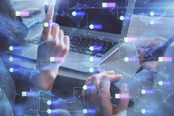Double exposure of man and woman working together and technology theme drawing hologram. Big data concept. Computer background.
