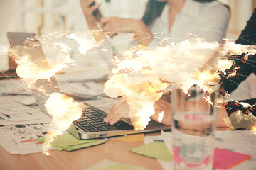 Double exposure of woman hands typing on computer and business theme hologram drawing. Success concept.