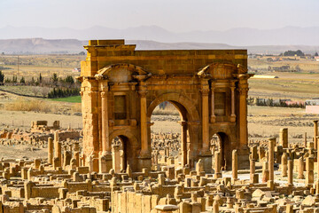Trajan's Arch of Timgad, a Roman-Berber city in the Aures Mountains of Algeria. (Colonia Marciana Ulpia Traiana Thamugadi). UNESCO World Heritage Site