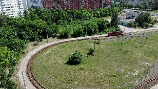 Tram depot where there are trams. Trams on the territory of the tram electric depot. Aerial drone view.