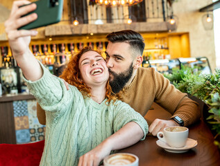 Young couple taking a selfie with eachother