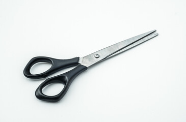 Small hairdressing scissors on white isolate