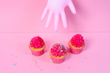 fresh homamde pink cupcakes on pink background