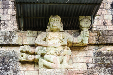 It's One of two simian sculptures on Temple 11, Howler Monkey Gods. Copan, Honduras