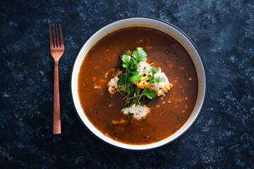 plant-based food, vegan lentil soup with caulini and broccolini and vegan cream cheese topping