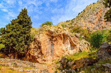 It's Delphi, an archaeological site in Greece, at the Mount Parnassus. Delphi is famous by the oracle at the sanctuary dedicated to Apollo. UNESCO World heritage