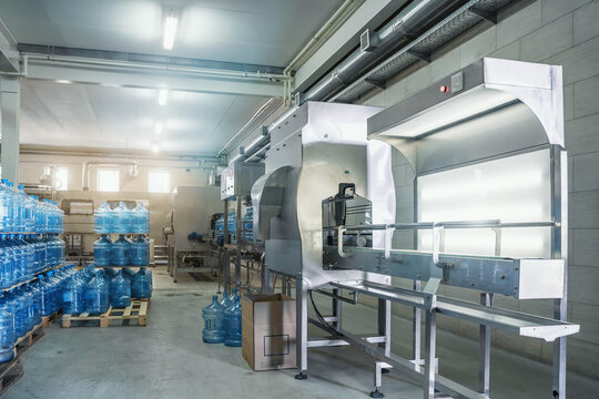 Industrial interior of water plant or factory production. Beverage factory, industry production line.
