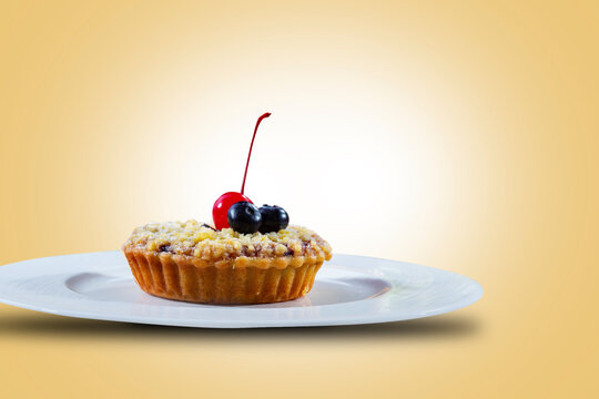 Pastei or Pie, for dessert and snacks. Fruit Pie is a food consisting of pastry skins and the contents of beans and chocolate and strawberry, cherry, and chocolate topping. Isolated in dark yellow.