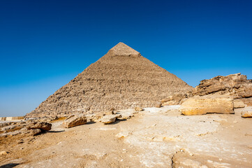 It's Pyramid of Khafre (Pyramid of Chephren), one of the Ancient Egyptian Pyramids of Giza and the tomb of the Fourth-Dynasty pharaoh Khafre