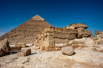 It's Pyramid of Khafre (Pyramid of Chephren), one of the Ancient Egyptian Pyramids of Giza and the tomb of the Fourth-Dynasty pharaoh Khafre