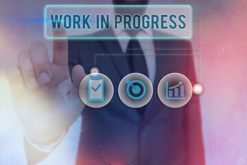 Writing note showing Work In Progress. Business concept for Ongoing Business with teamwork,...