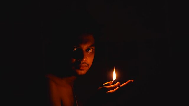 brahmin sadhu holding  diya(oil lamp)