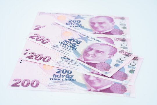 Turkish money 100 and 200 TL banknot lines on white background