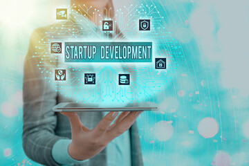 Conceptual hand writing showing Startup Development. Concept meaning developing idea which...