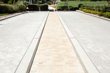 A view of a multi-purpose concrete field used for games such as horseshoe, lawn bowling and bocce ball, seen at a local park in Los Angeles, California.