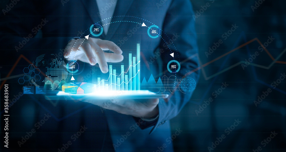 Fototapete businessman using tablet analyzing sales data and economic growth graph chart on virtual interface. 