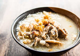 Pork bone boiled rice  in bowl, out door Chiangmai Thailand