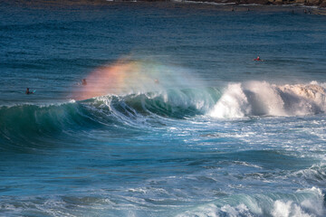 Rainbow over a breaking wave, Sydney Australia