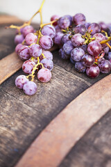 Grape on a wooden barrel isolated on white. Macro image.