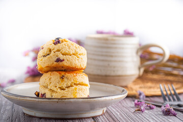 Traditional British scones with a tea cup and blurred background