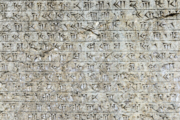 It's Relief of the ancient alphabet. Persepolis, the ceremonial capital of the Achaemenid Empire. UNESCO World Heritage