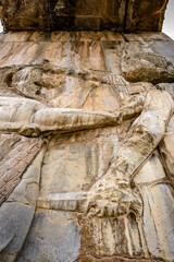 Fototapeta na wymiar It's Ancient relief in Persepolis, the ceremonial capital of the Achaemenid Empire. UNESCO World Heritage