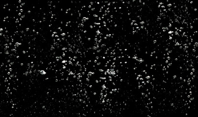 Abstract water background. Air bubbles water floating on black background. 