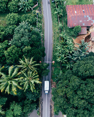 The top view of transport truck in the village road