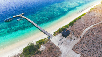 Aerial view of a small wooden pier at in Paserang Island, Sumbawa, Indonesia