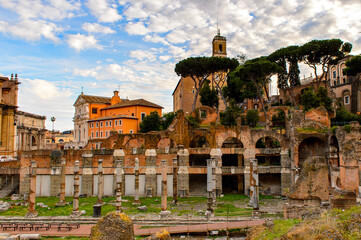 It's Roman Forum in the evening, a rectangular forum surrounded by the ruins of several important...