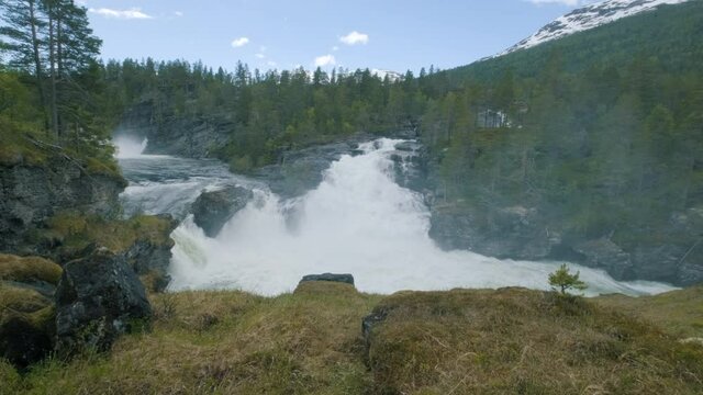 A majestic waterfall in the middle of the norwegian woods