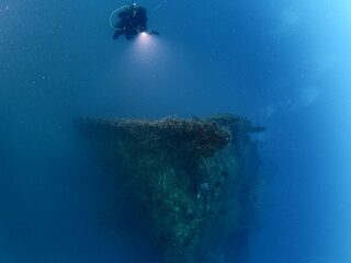 scuba divers exploring a ship wreck submarine u boat underwater worl war 2 ocean floor