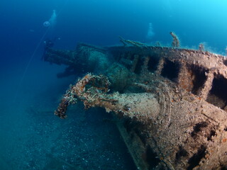 scuba divers exploring a ship wreck submarine u boat underwater worl war 2 ocean floor