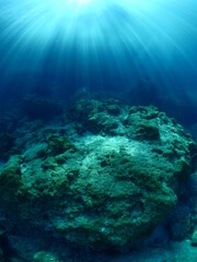 Fototapeta na wymiar sun ray and sun beam scenery underwater waves on surface of water slow ocean scenery backgrounds