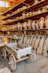 It's Dishes and other things in Pompeii, an ancient Roman town destroyed by the volcano Vesuvius. UNESCO World Heritage site