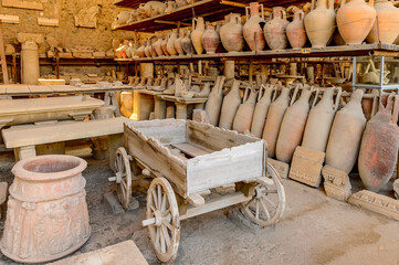 It's Dishes and other things in Pompeii, an ancient Roman town destroyed by the volcano Vesuvius....
