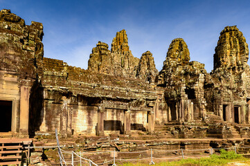 Naklejka premium It's Bayon, Khmer temple at Angkor in Cambodia. Official state temple of the Mahayana Buddhist King Jayavarman VII