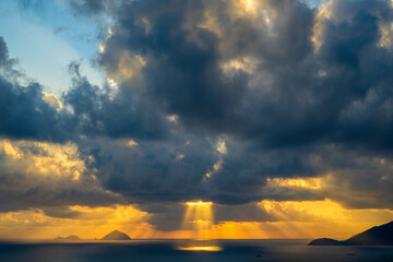 Landscape sunrise on Hon Chong cape, Nha Trang, Vietnam. Travel and nature concept. Morning sky, clouds, sun and sea water